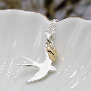 Silver plated swallow necklace with golden heart